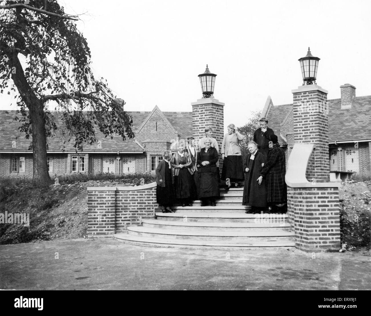 A group of elderly women at the Glovers Trust Almshouses, Chester Road, Boldmere, Sutton Coldfield. These have replaced the Ebenezer Almshouses, Steelhouse Lane. They are one bedroom bungalows. Circa 1930. Stock Photo