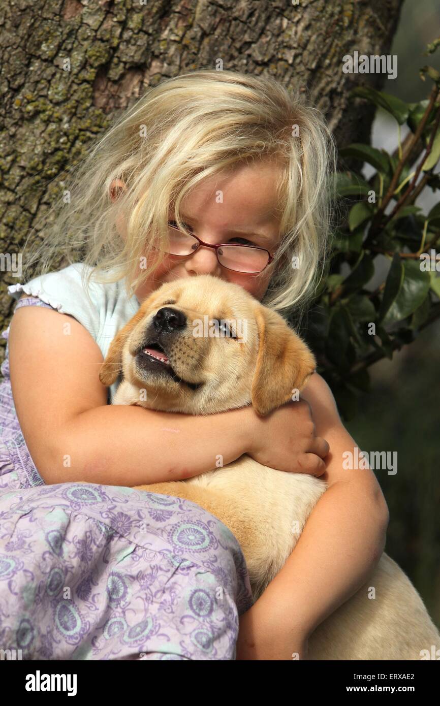 girl with Labrador Retriever Puppy Stock Photo Alamy