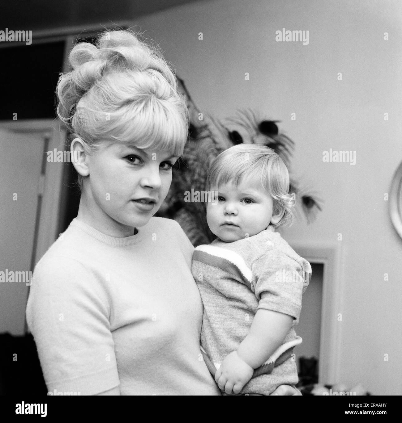 Perrin Lewis, wife of singer Vince Holden, pictured with their son Ty Holden. 16th February 1963. Stock Photo