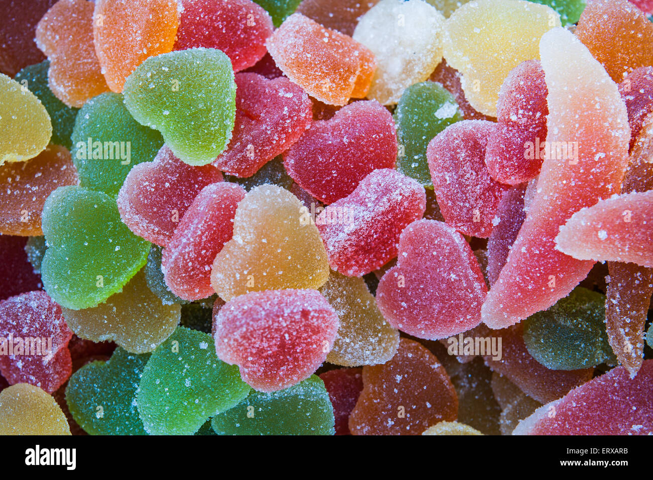 Fruit jellies of different forms and colors with sugar icing on display