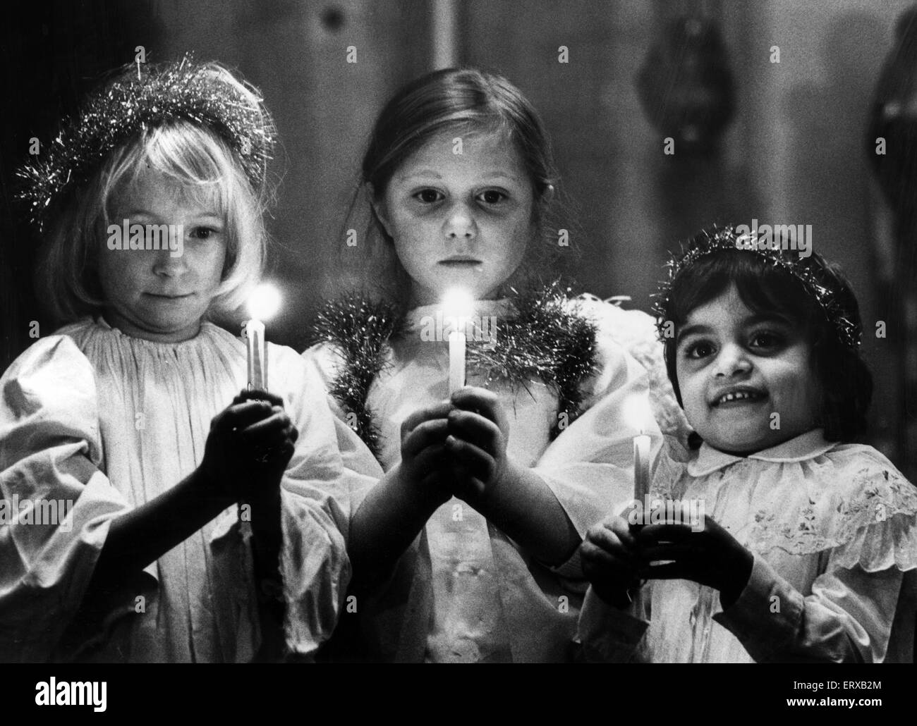 Pupils at Kings School, Wordswoth Crescent, Cardiff, hold a carol service at St German's Church in Roath, Wales, 15th December 1981. Three of the angels are pictured at rehearsals from left, Kim Latham, Caitlin Douse and Mary Constaninou. Stock Photo