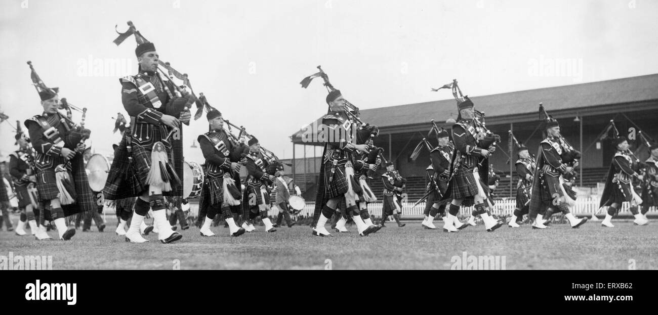 Pipers who took part in the broadcast from the South Shields Stadium, wearing their kilts and playing the bagpipes. 26th August 1935. Stock Photo
