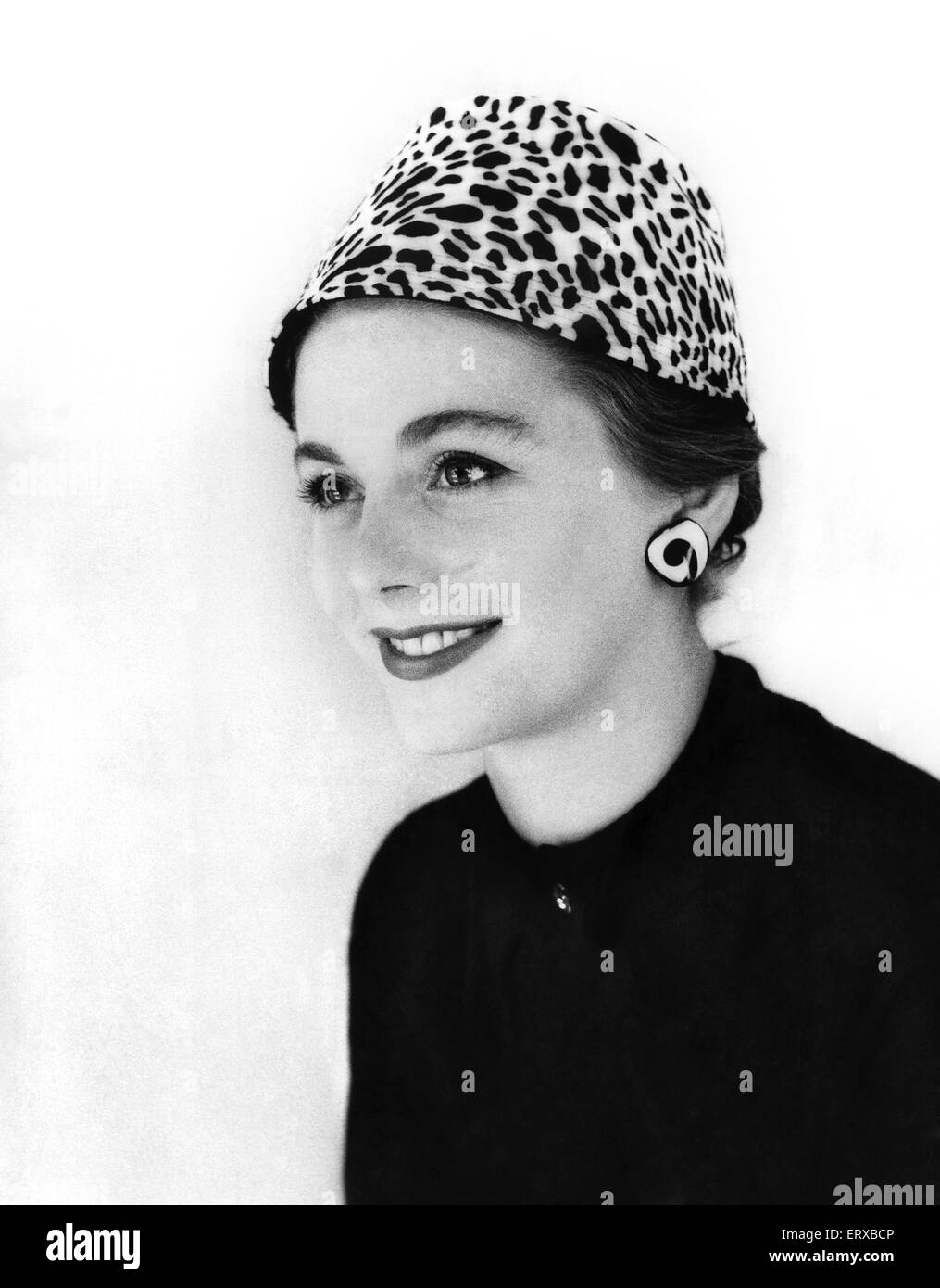 A woman modelling an animal print hat. 13th September 1955 Stock Photo