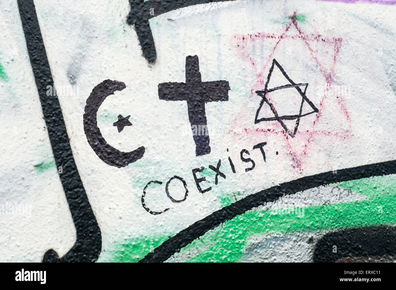 racism, religion in Berlin behind the wall  ray Boswell Stock Photo