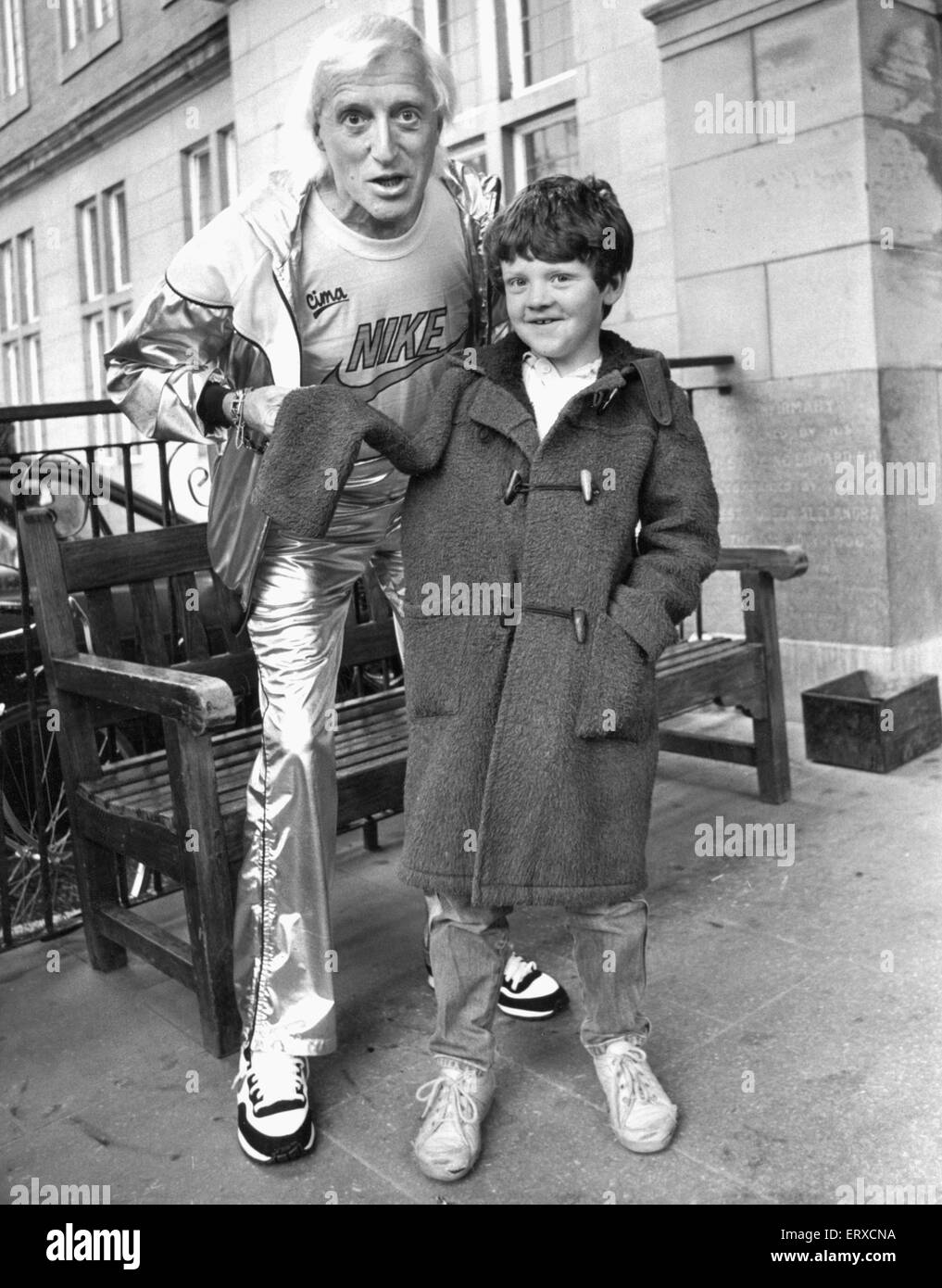 Jimmy Savile meets seven year old Lee Claffey of Eastwood Gardens Kenton Newcastle who was visiting the Royal Victoria Infirmary to have his broken arm checked. 7th June 1986  A further 19 hospitals are to have their links with disgraced television presenter and disc jockey  Jimmy Savile to be investigated Health Secretary Jeremy Hunt has said. In a written ministerial statement he expected reports to be delivered by next June.  They are in addition to an initial 13 inquiries into hospitals which are believed to have been visited by the disgraced television presenter. Savile is thought to Stock Photo