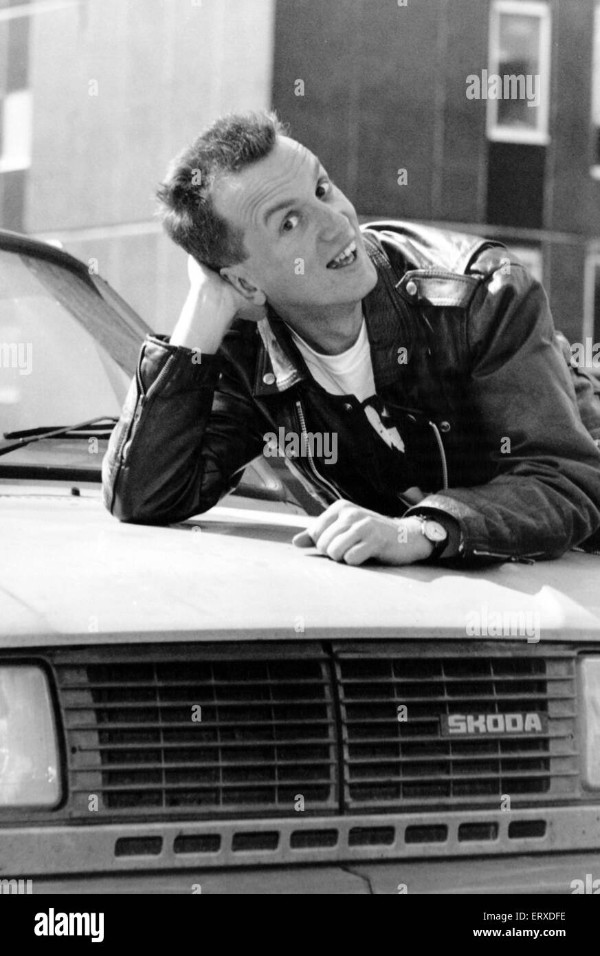 Comedian Frank Skinner who has just returned from the Edinburgh Festival, leaning on a car bonnet, 7th September 1990. Stock Photo