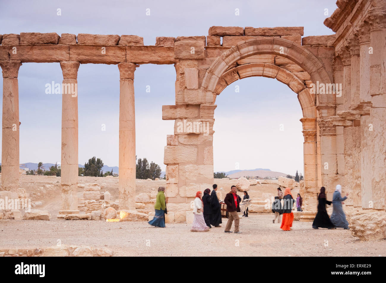 Visitors walking in the Ruins of the ancient city of Palmyra, Syrian ...
