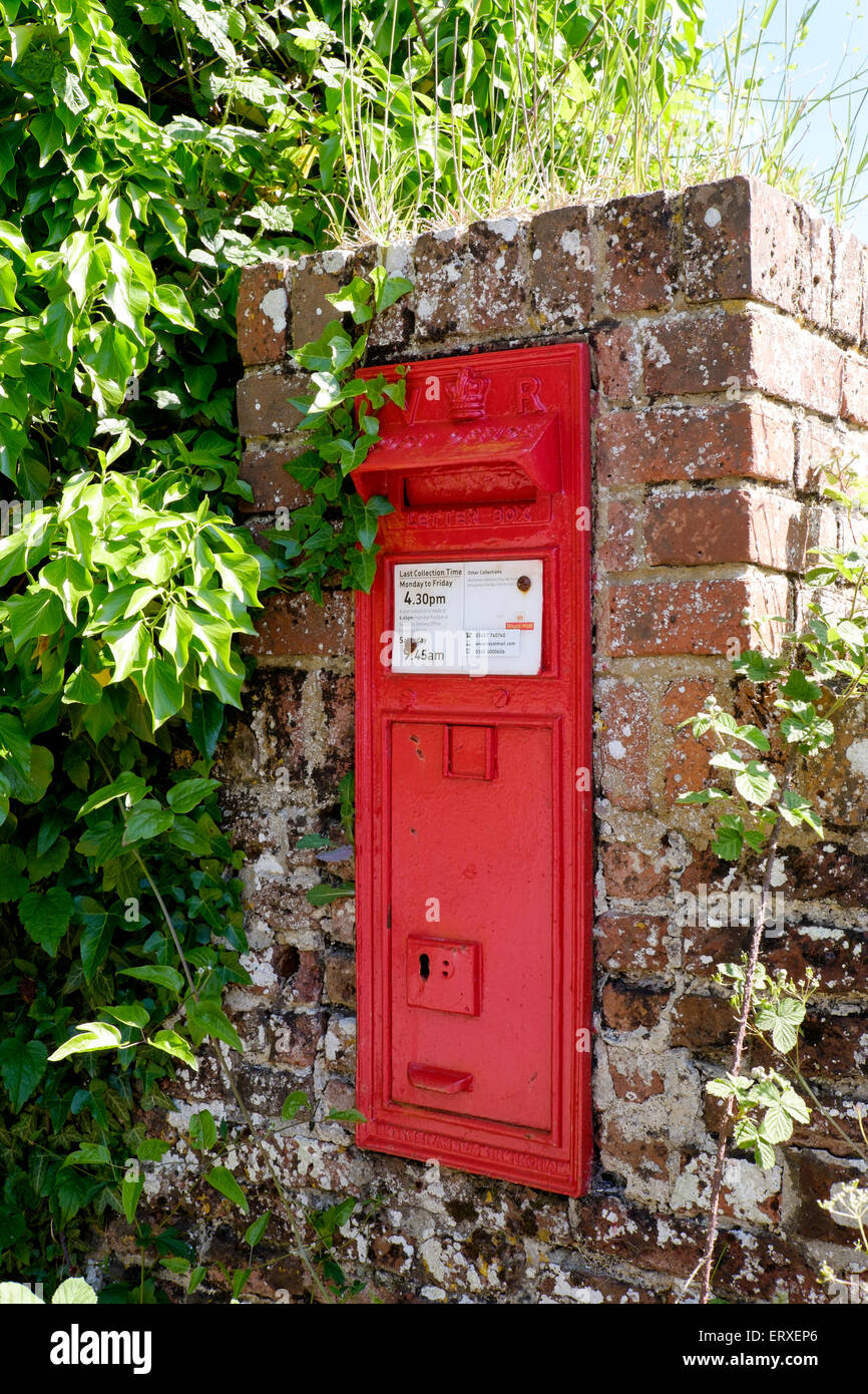 Old Victorian red post box set into red brick pillar UK Stock Photo