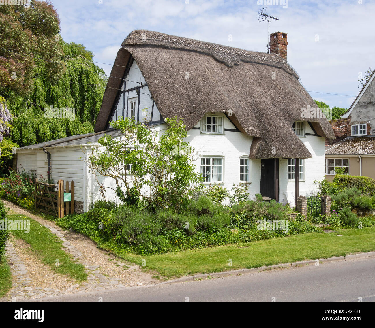 Thatched Cottage in the village of Martin, Hampshire, England, UK Stock