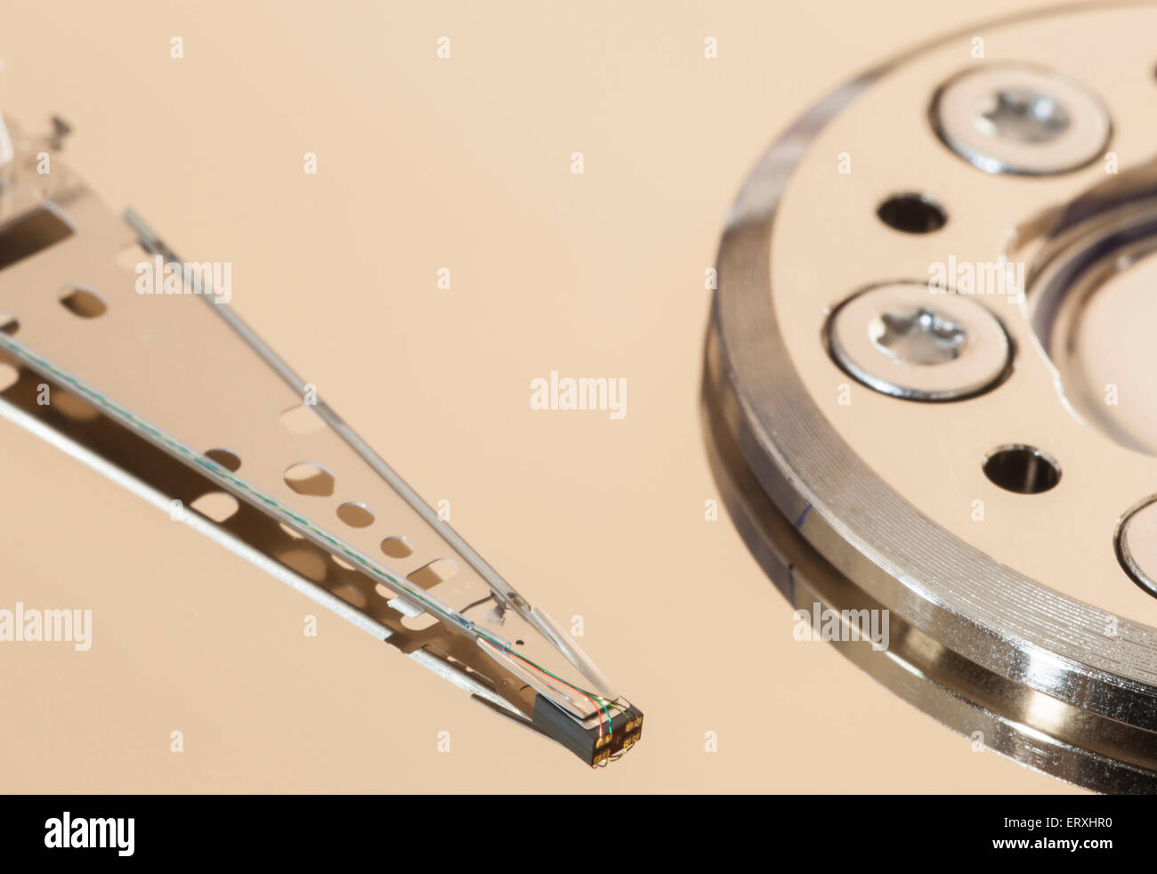 Detail of a computer hard drive showing the disk and read-write arm Stock Photo