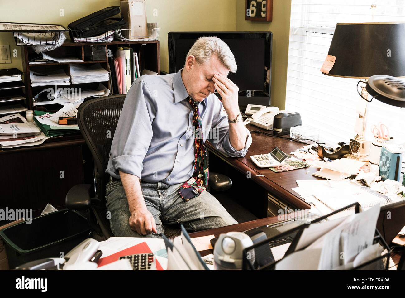 Businessman in Hoarders' Messy Home Office, USA Stock Photo Alamy