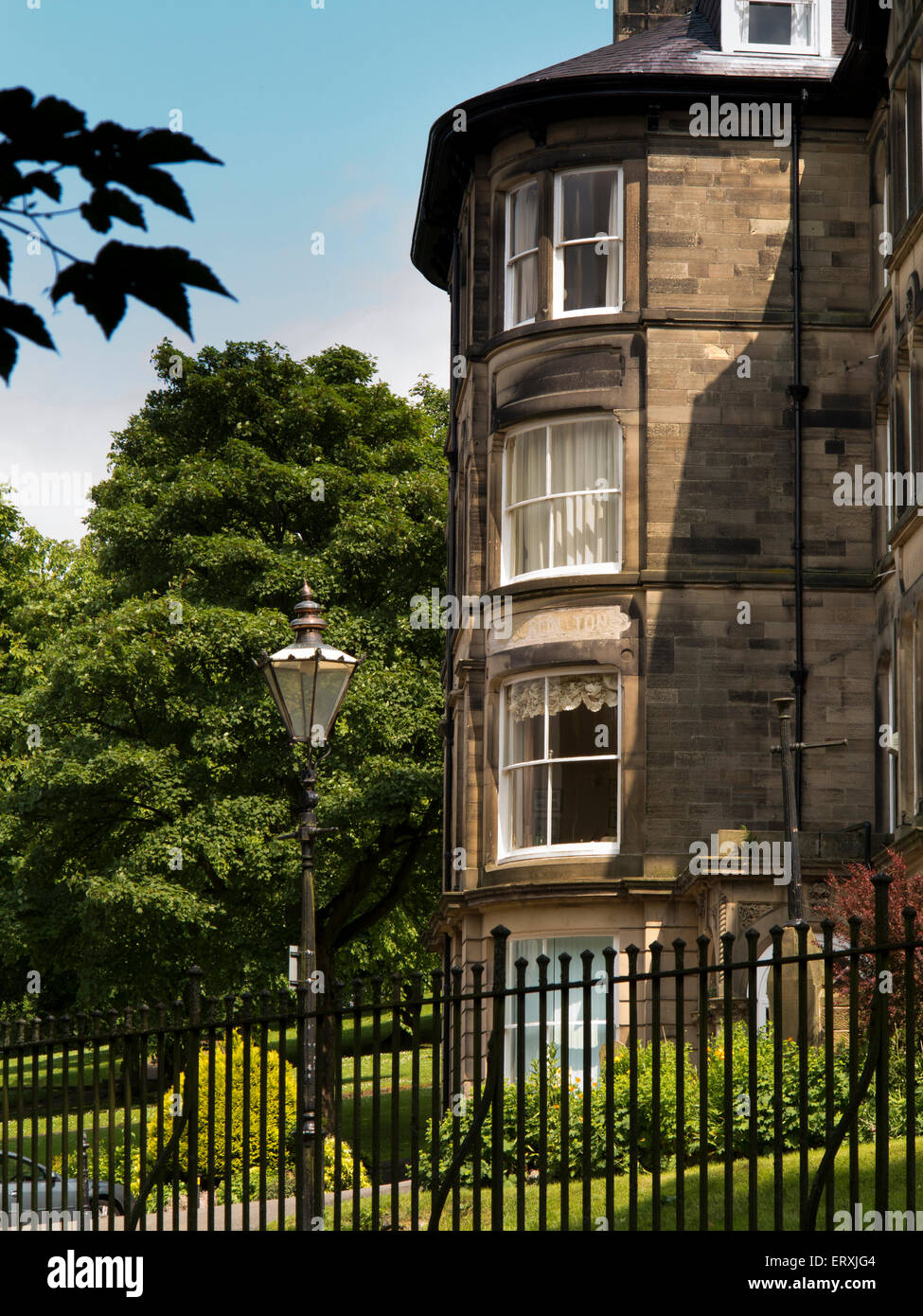 UK, England, Derbyshire, Buxton, Broad Walk, elegant stone built four storey house beside Pavilion Gardens Stock Photo