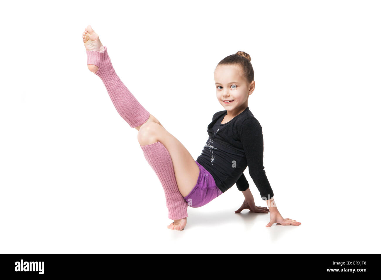 Young little girls gymnastics" Little girl doing gymnastics hi-res stock photography and images - Alamy