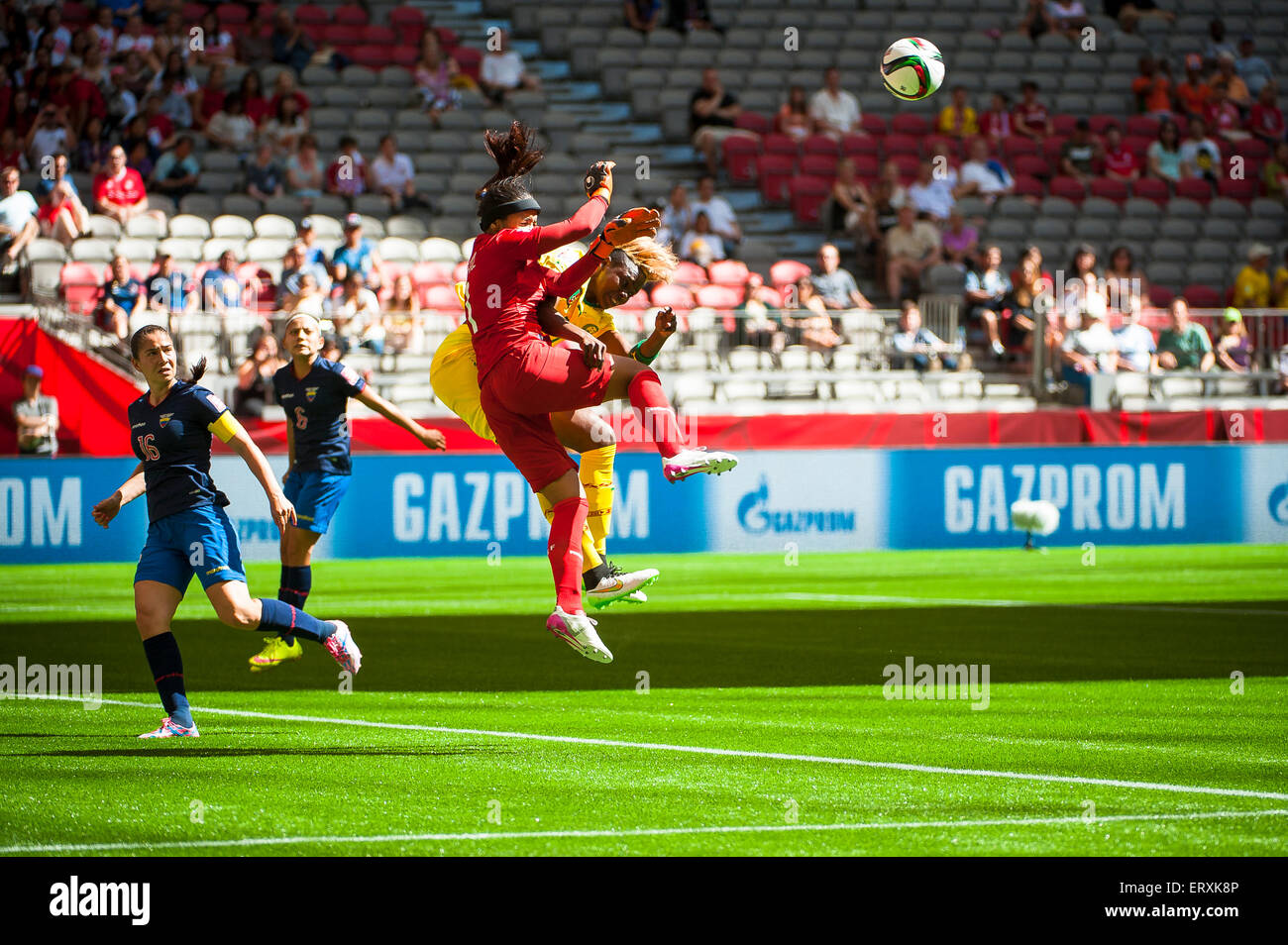 Vancouver, Canada. 8th June, 2015. Cameroon forward Gaelle ENGANAMOUIT (#17) collides with Ecuador goalkeeper Shirley BERRUZ (#1) during the opening round match between Cameroon and Ecuador of the FIFA Women's World Cup Canada 2015 at BC Place Stadium. Cameroon won the match 6-0. Credit:  Matt Jacques/Alamy Live News Stock Photo
