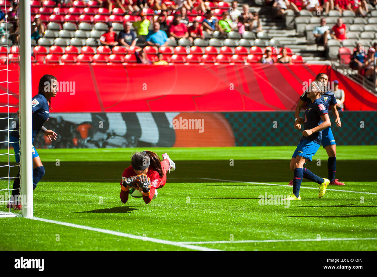Vancouver, Canada. 8th June, 2015. Ecuador goalkeeper Shirley BERRUZ (#1) dives with the ball during the opening round match between Cameroon and Ecuador of the FIFA Women's World Cup Canada 2015 at BC Place Stadium. Cameroon won the match 6-0. Credit:  Matt Jacques/Alamy Live News Stock Photo