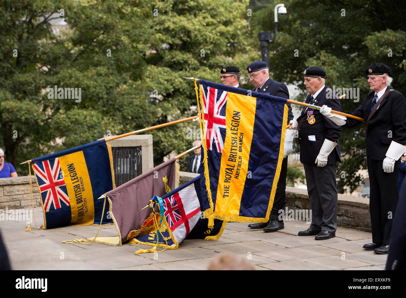 UK, England, Derbyshire, Buxton, War Memorial service commemorating start of WW1, British Legion standard bearers dipping flags Stock Photo