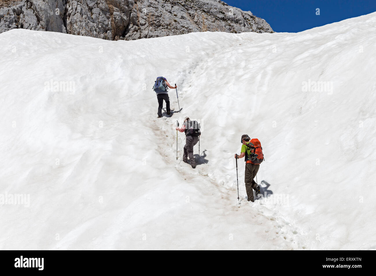 Hikers Climbing up to the Collado Pedabejo Picos de Europa Mountains, Cantabrica, Spain Stock Photo