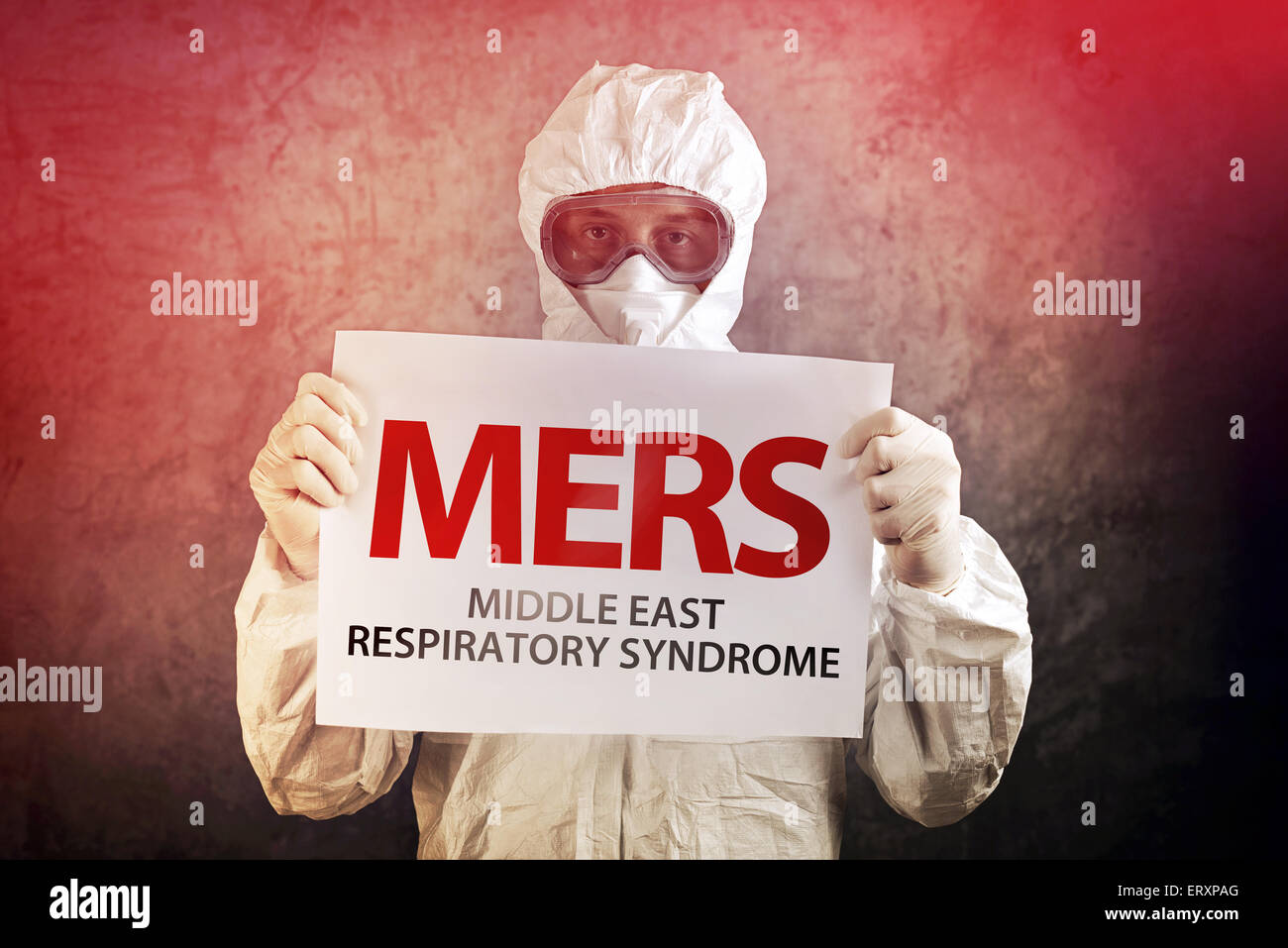 Medical Scientist Holding Banner with MERS Virus Definition Stock Photo
