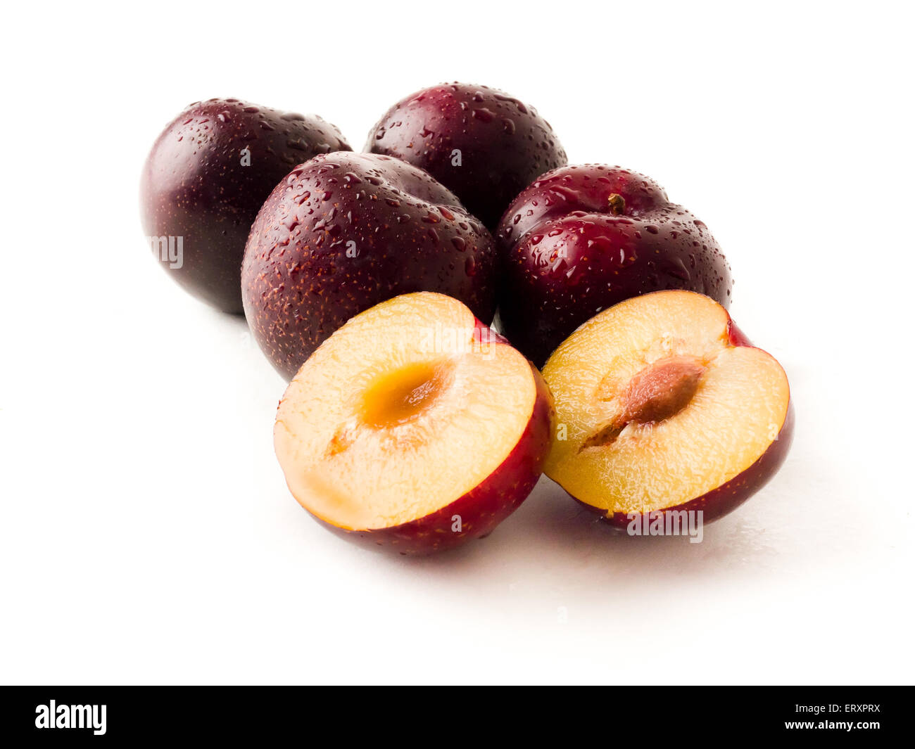 Bundle of red plums on a isolated white background Stock Photo