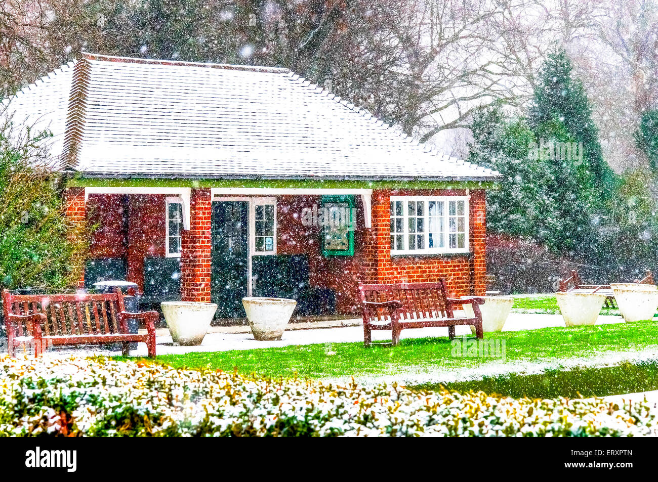 Redbrick House in a Park. Christmas Scenery and Fresh Snow. Cloudy Day. Battersea Park, London Stock Photo