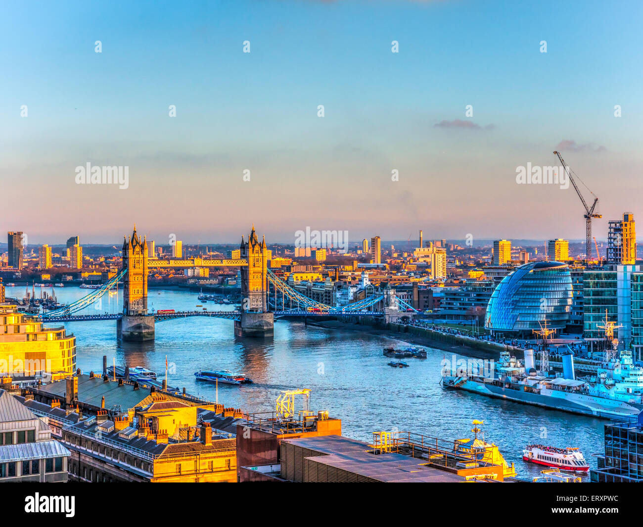 Aerial Overview of River Thames in Sunset in London. Tower Bridge and the City Hall in the Background Stock Photo