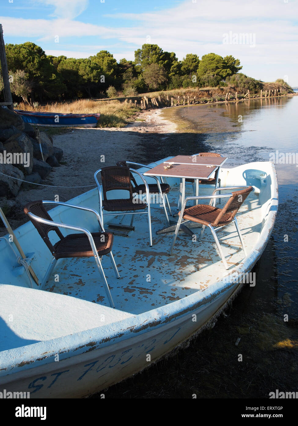 table and chairs on boat Stock Photo Alamy