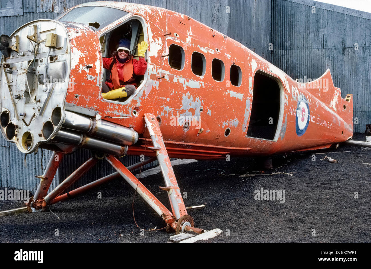 A visitor to Antarctica waves from a de Havilland Otter aircraft once