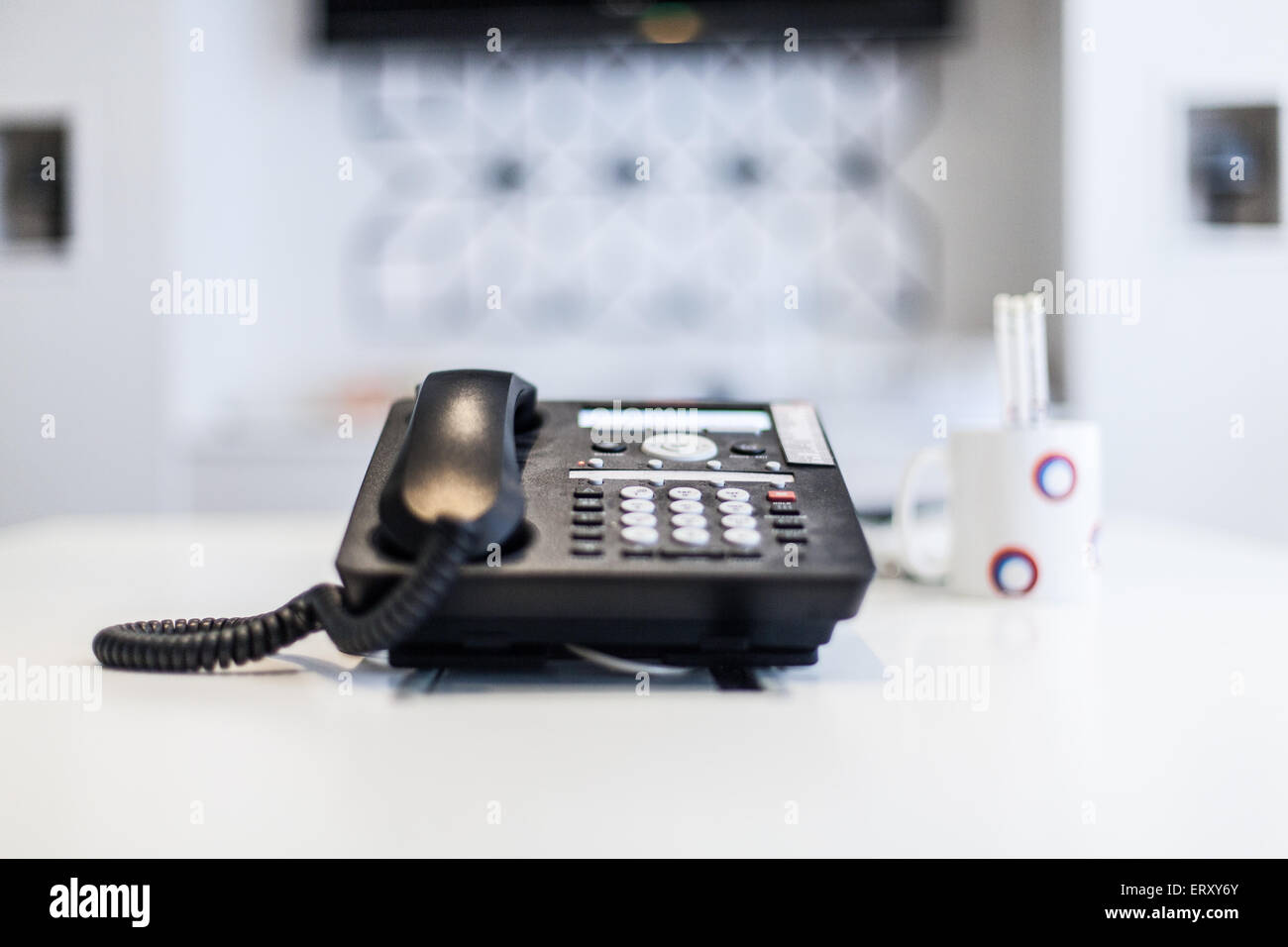 Office phone on white desk Stock Photo
