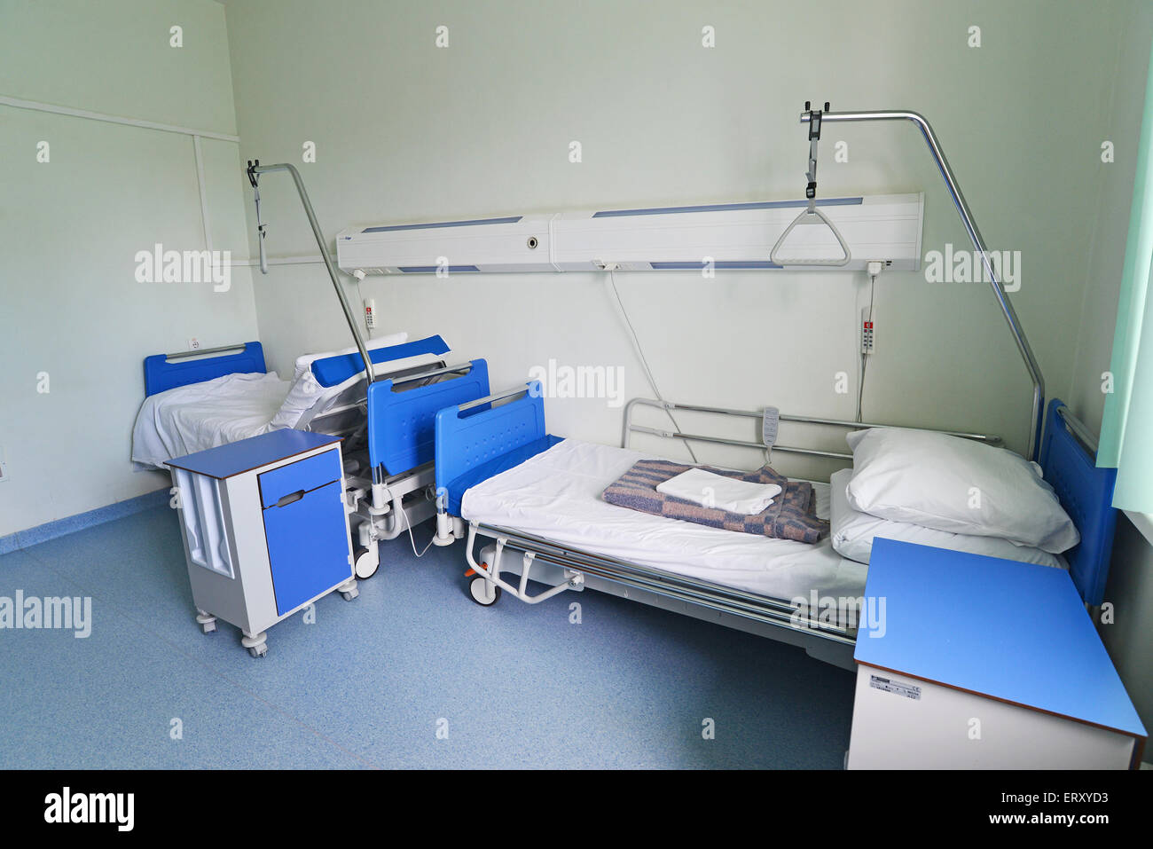 Hospital beds in a private hospital ward Stock Photo