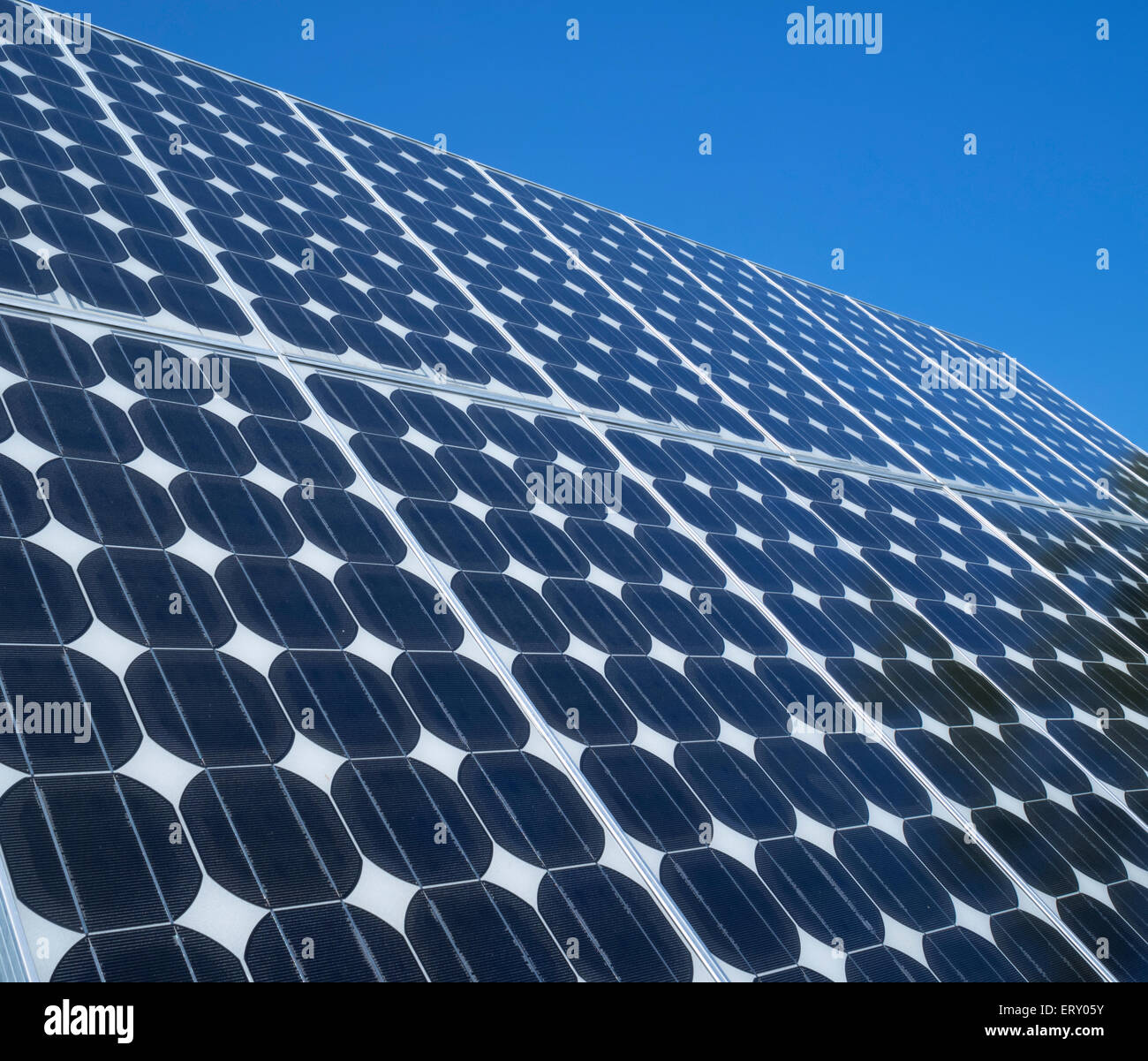 Solar panel photovoltaic cells array close up blue sky copy space Renewable energy clean eco-friendly power source Stock Photo