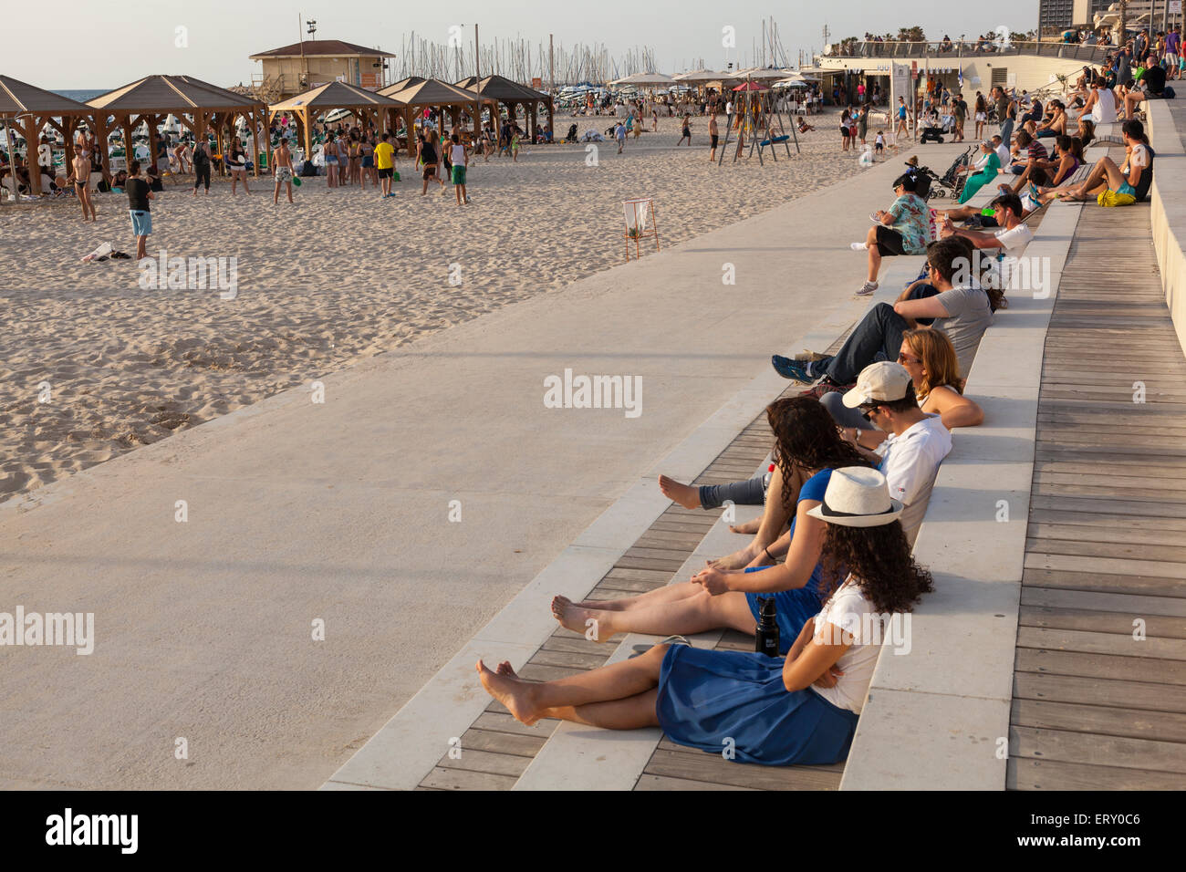 people sitting along Tel Aviv seafront , Israel Stock Photo