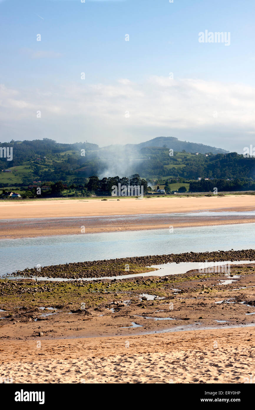 a landscape with smoke in a magnificent scenary of a estuary Stock Photo