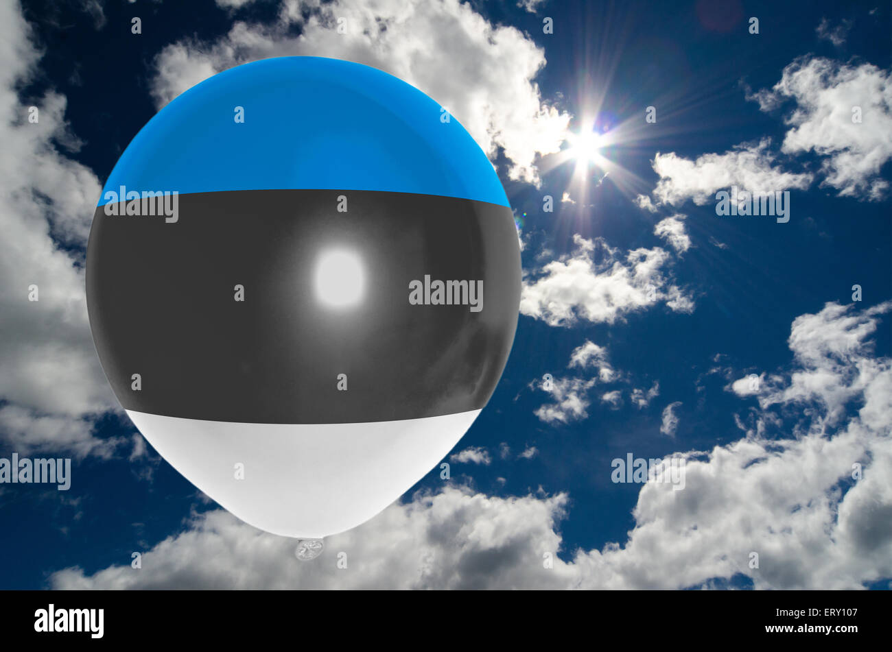 balloon in colors of estonia flag flying on blue sky Stock Photo - Alamy