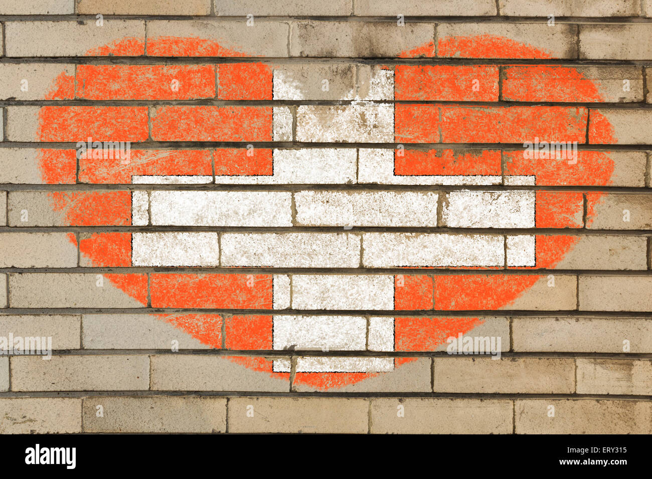heart shaped flag in colors of schwitzerland on brick wall Stock Photo