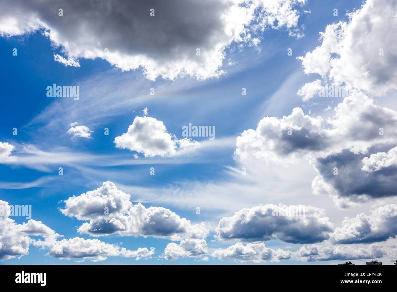 Blue Cloudy Sky With Different Sized and Shaped Clouds Stock Photo - Alamy