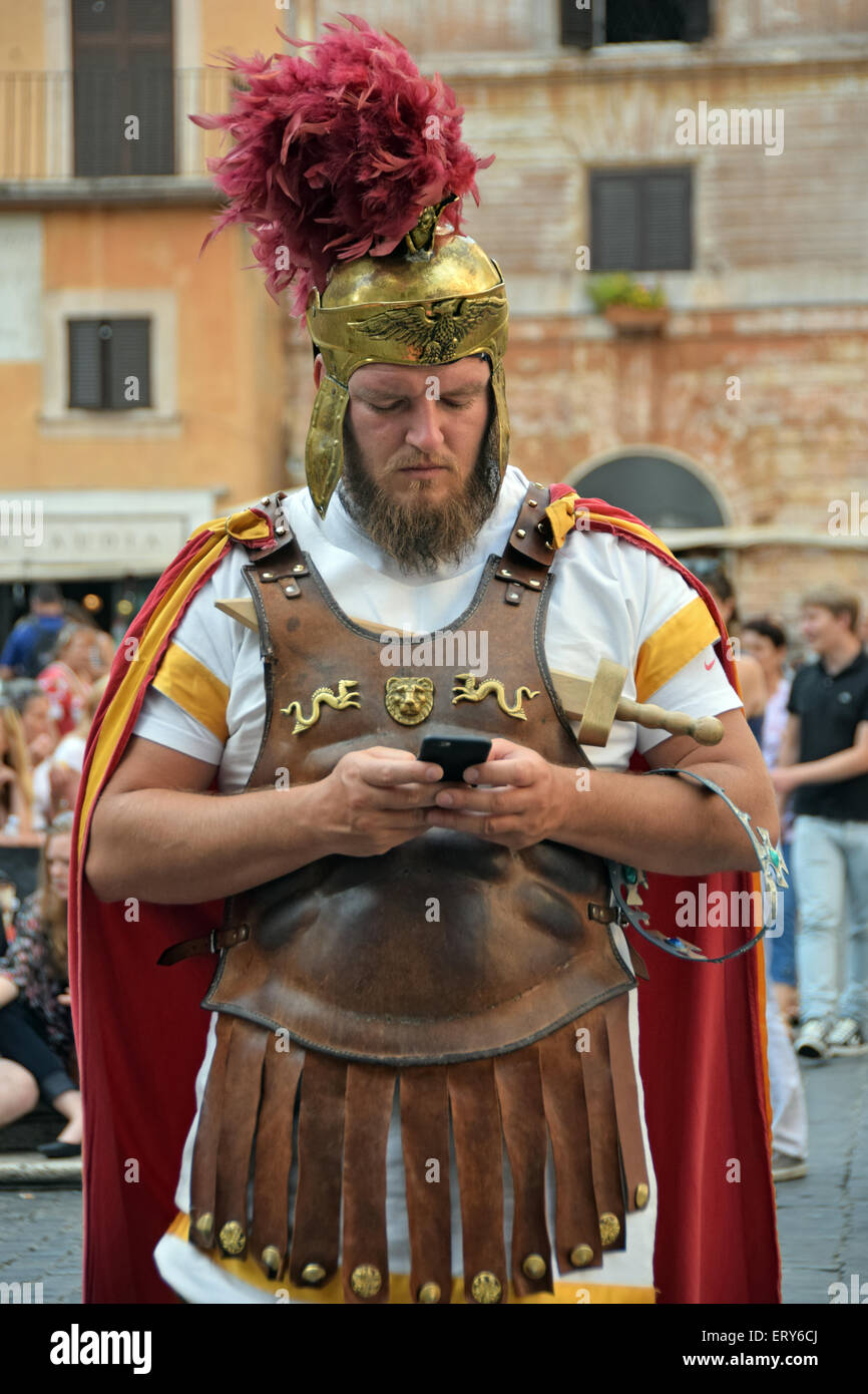A busker dressed as a gladiator near the Pantheon in Rome, Italy checks ...