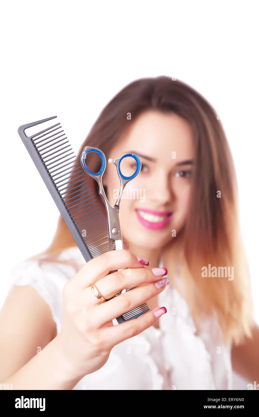 Cute woman hairdresser with scissors and comb Stock Photo - Alamy