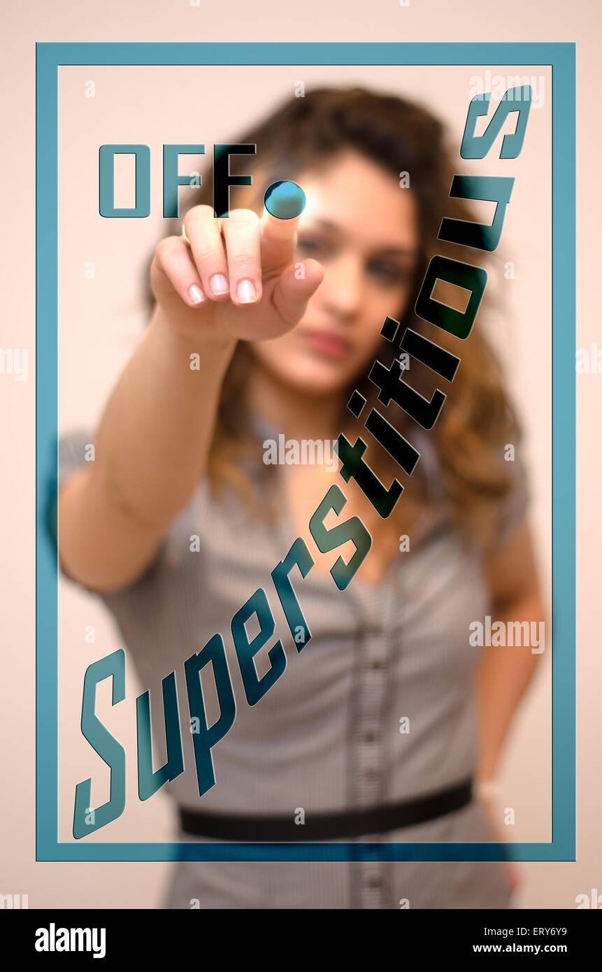young woman turning off Superstitious on screen Stock Photo