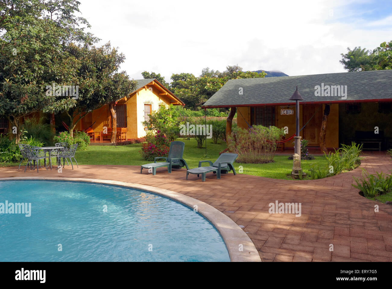 Swimming pool and guest cabins at Hotel Santa Leticia near Apaneca in western El Salvador, Central America Stock Photo
