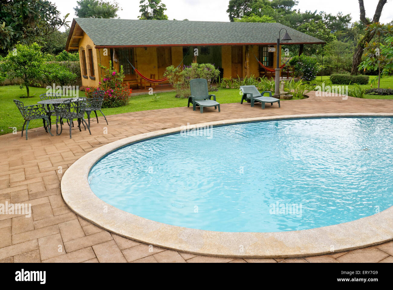 Swimming pool and guest cabins at Hotel Santa Leticia near Apaneca in western El Salvador, Central America Stock Photo