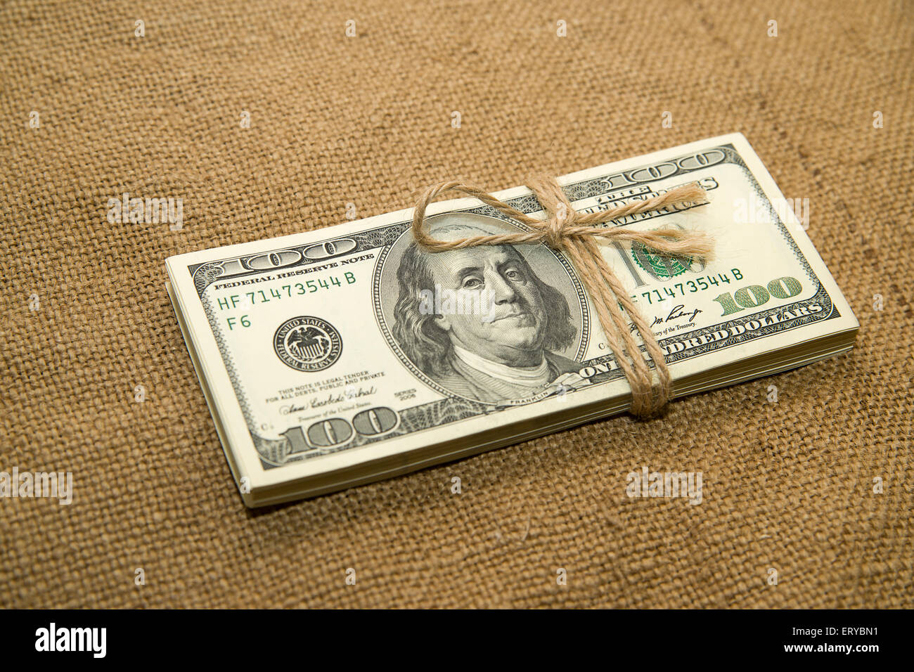 One pack of dollars tied up with rope in the old cloth Stock Photo