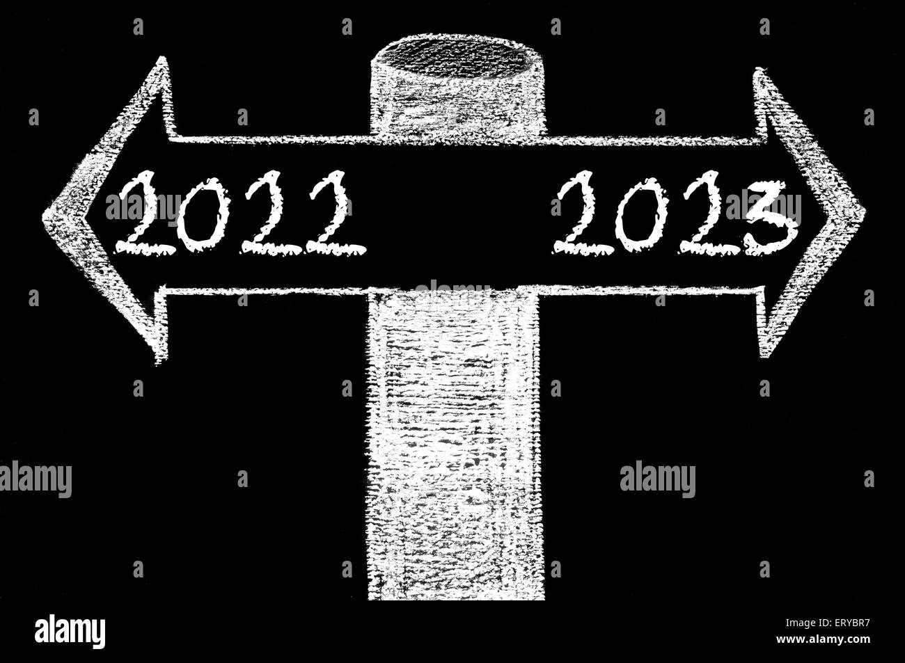 Opposite arrows with Year 2022 versus Year 2023. Hand drawing with chalk on blackboard. Choice conceptual image Stock Photo