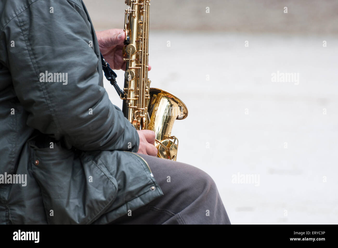 Street musician play the saxophone in the park Stock Photo