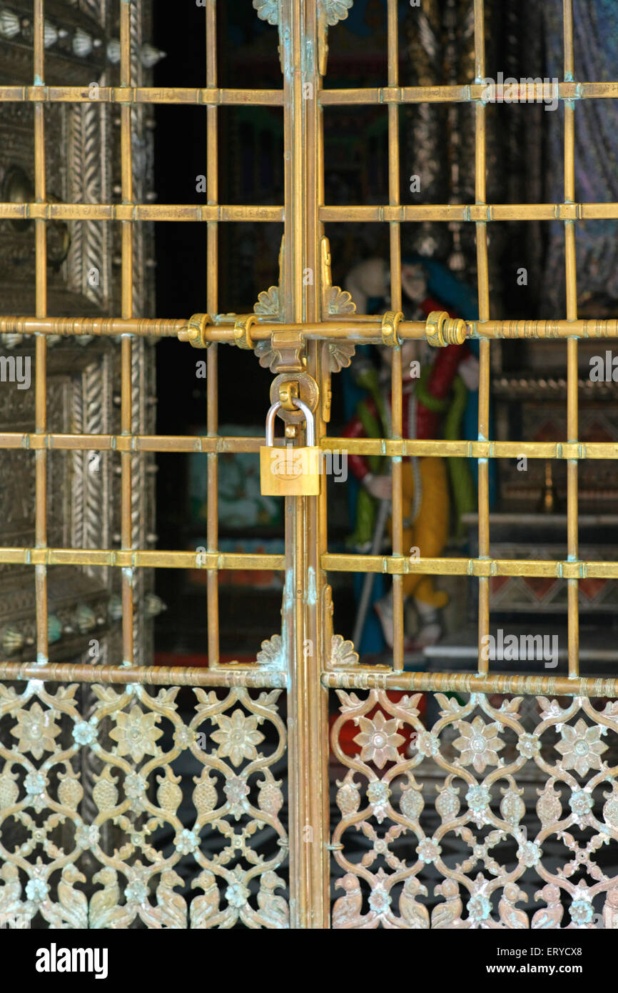 Locked brass metal gate , Shree Swaminarayan Mandir temple ; Chhapia , Chhapaiya , Ayodhya ; Faizabad ; Uttar Pradesh ; India , Asia Stock Photo
