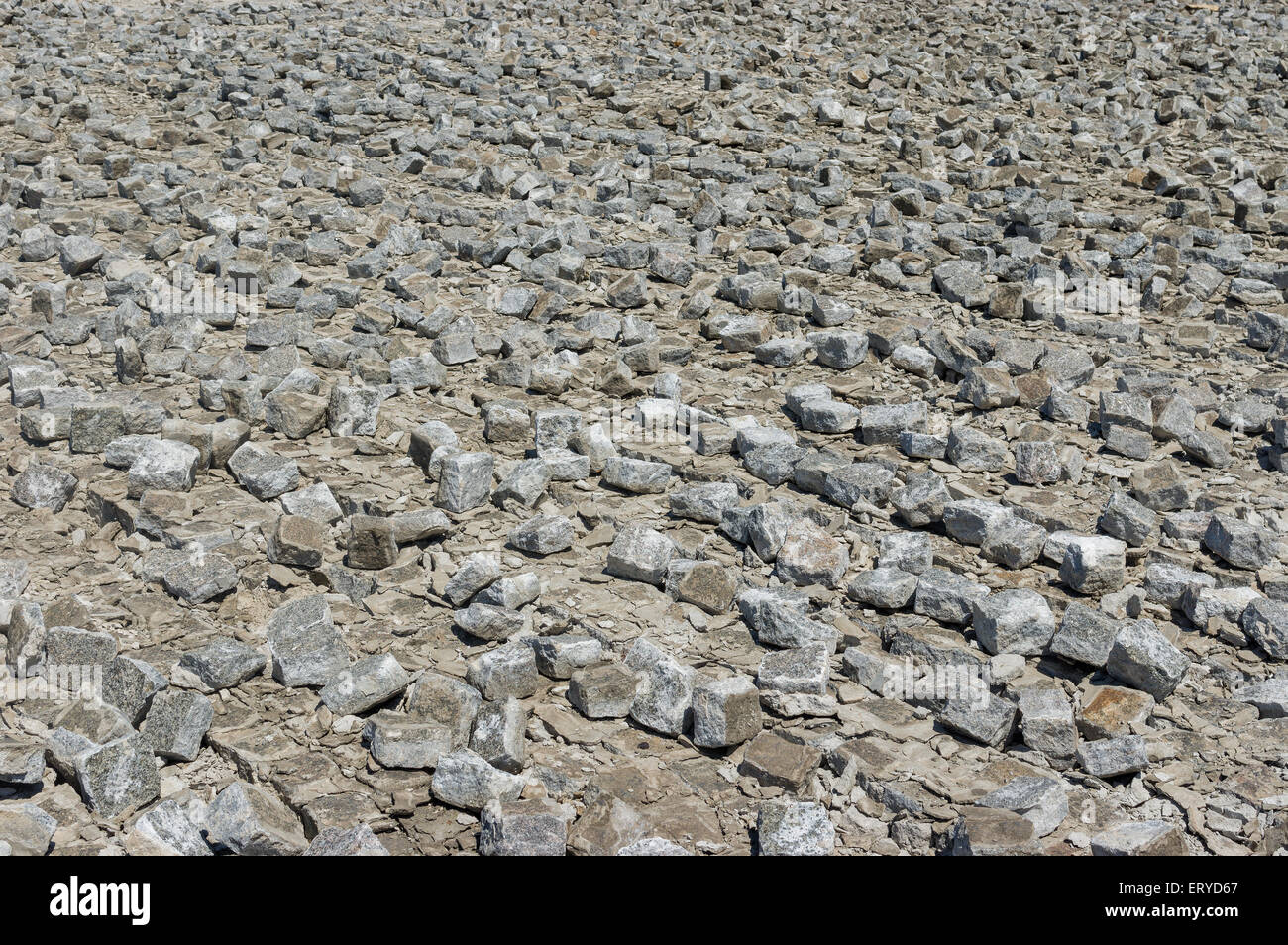 Industrial background - dismantled cobblestone pavement Stock Photo