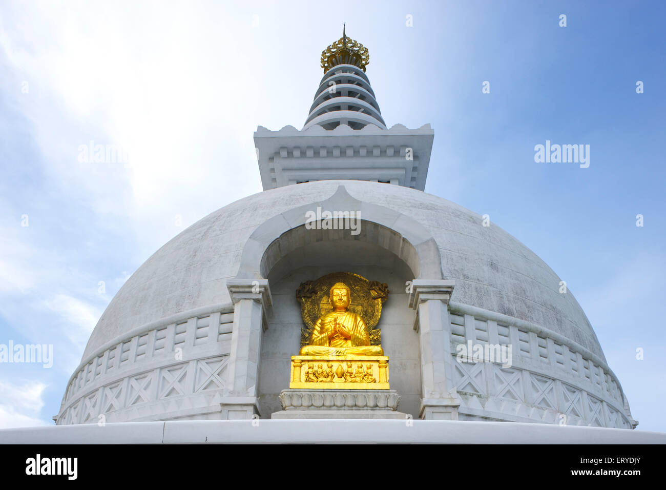 Golden statue of lord Gautam Buddha ; Buddhist site ; Vishwa Shanti (World Peace) stupa ; Rajgir ; Bihar ; India Stock Photo