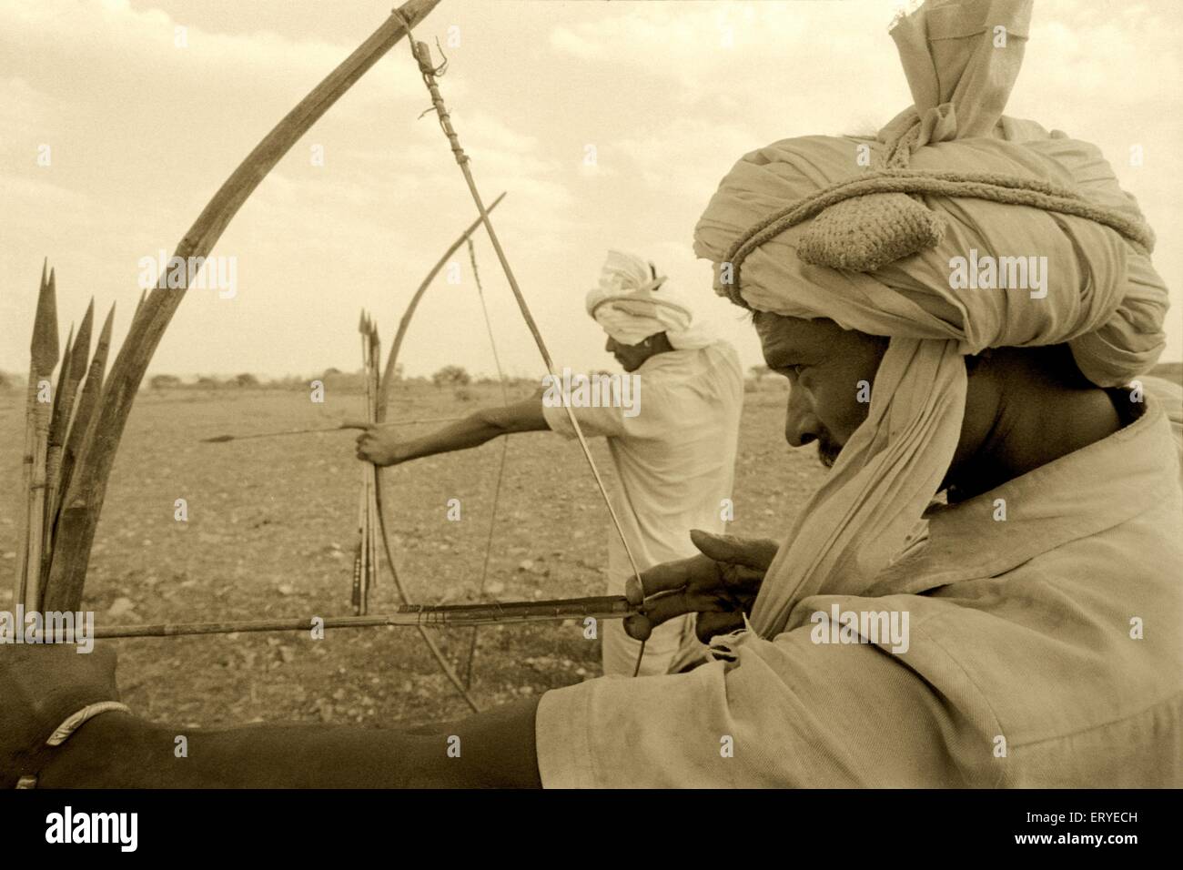 Zabua tribe with bow arrow ; Madhya Pradesh ; India Stock Photo