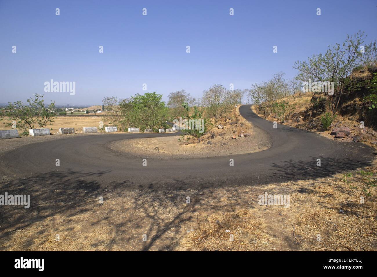 hairpin turn , hairpin bend , hairpin corner , road near Nasik ; Nashik , Maharashtra ; India , asia Stock Photo