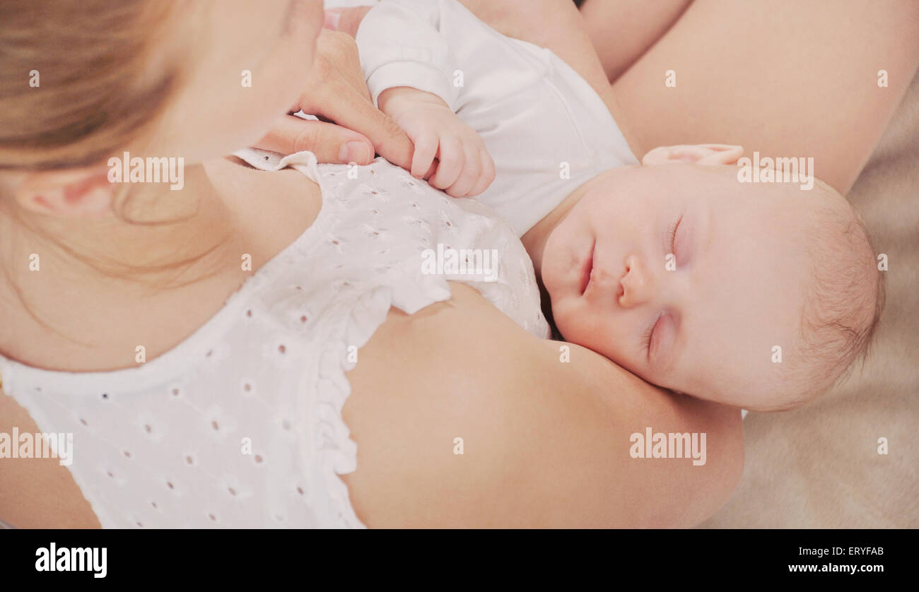 mother and her newborn baby, maternity concept, soft image of beautiful family Stock Photo