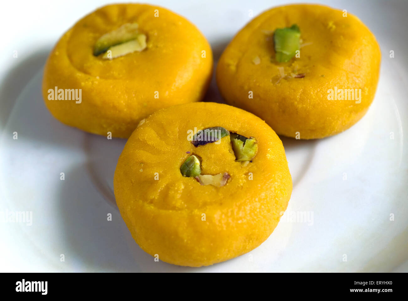 kesar mawa peda garnish with pistachio , saffron khoya peda , khoa pera , Stock Photo
